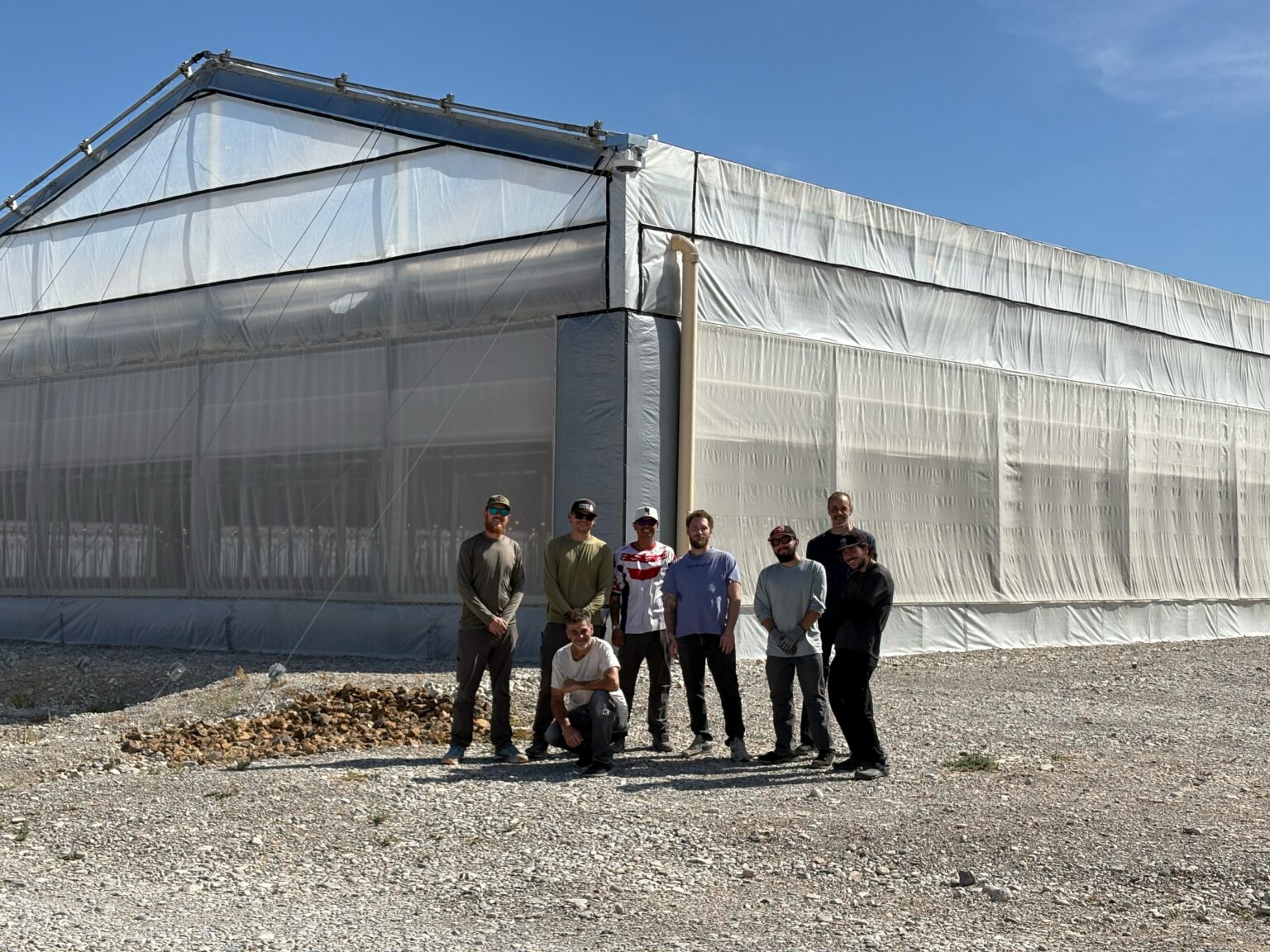 The All Day cultivation team outside the Snow Mountain greenhouse in Las Vegas